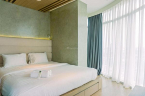 Spacious and Homey 2BR at Tree Park City Cikokol Apartment By Travelio